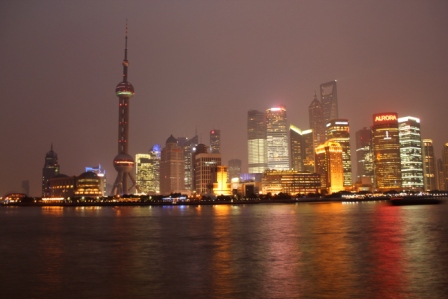 Shanghai's Pudong Skyline at night, including the pink Oriental Pearl Tower